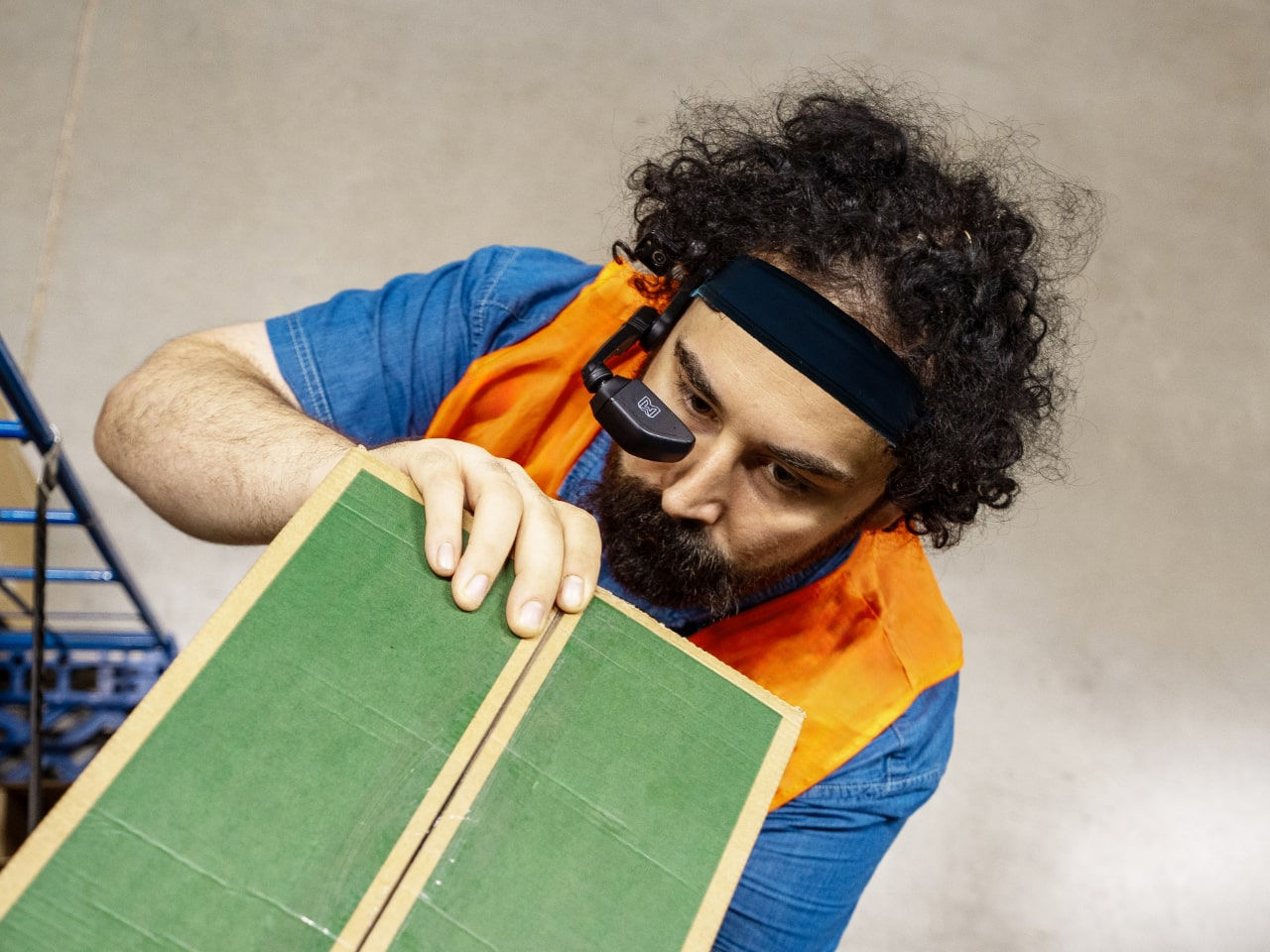 Employee in warehouse with smart glasses