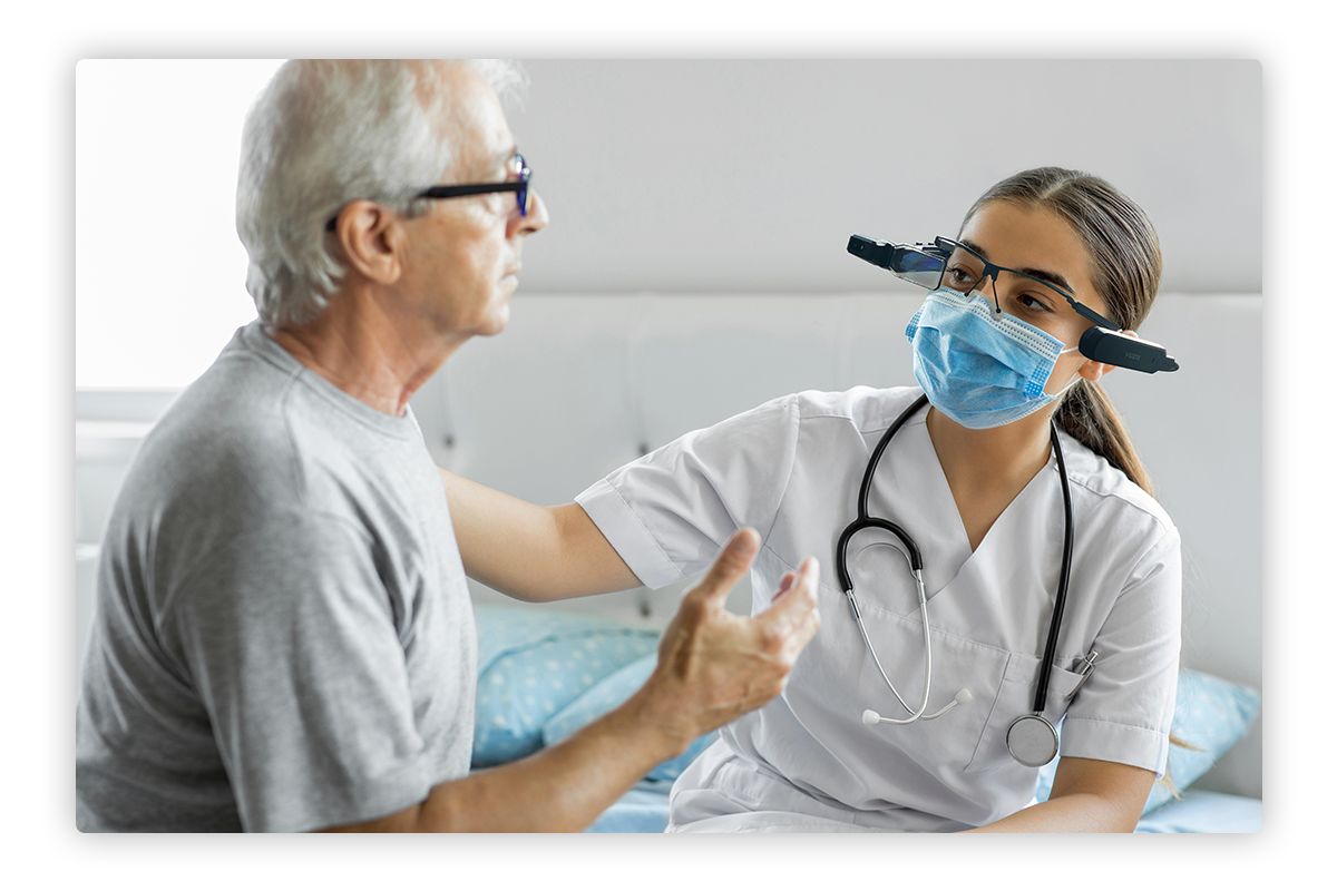 Doctor taking care of a patient with the help of smart glasses