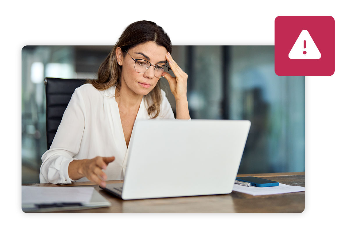 Woman looking worried at laptop