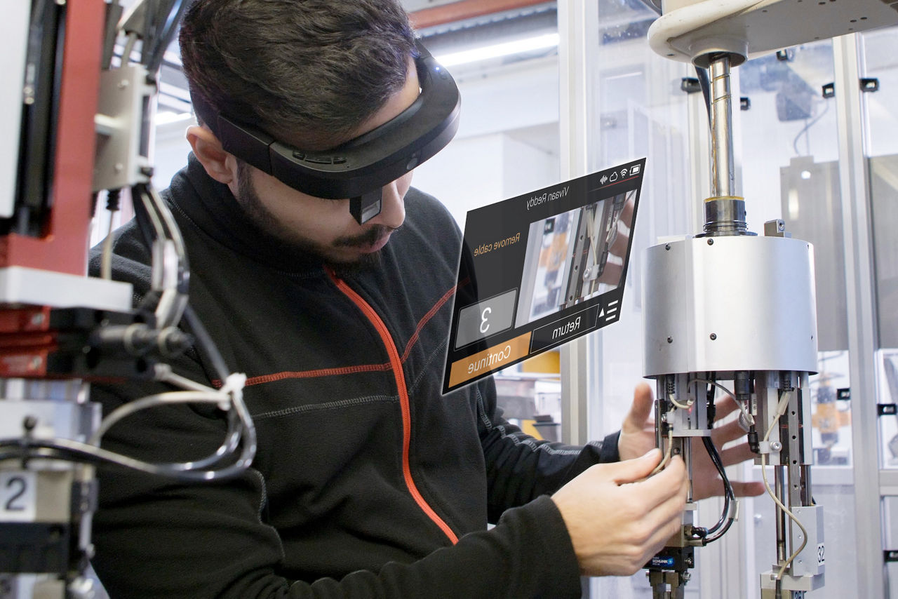 Mechanic working on car with AR