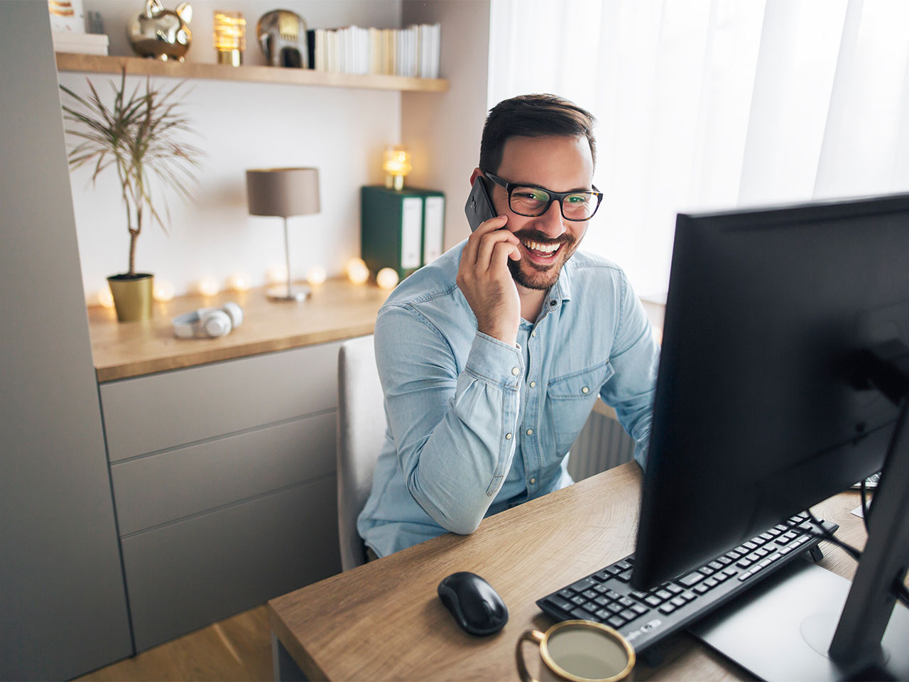 Man taking a call working from home