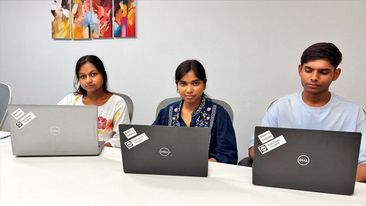 Students in India with donated laptops