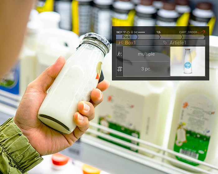 Man holding up milk bottle with AR confirmation