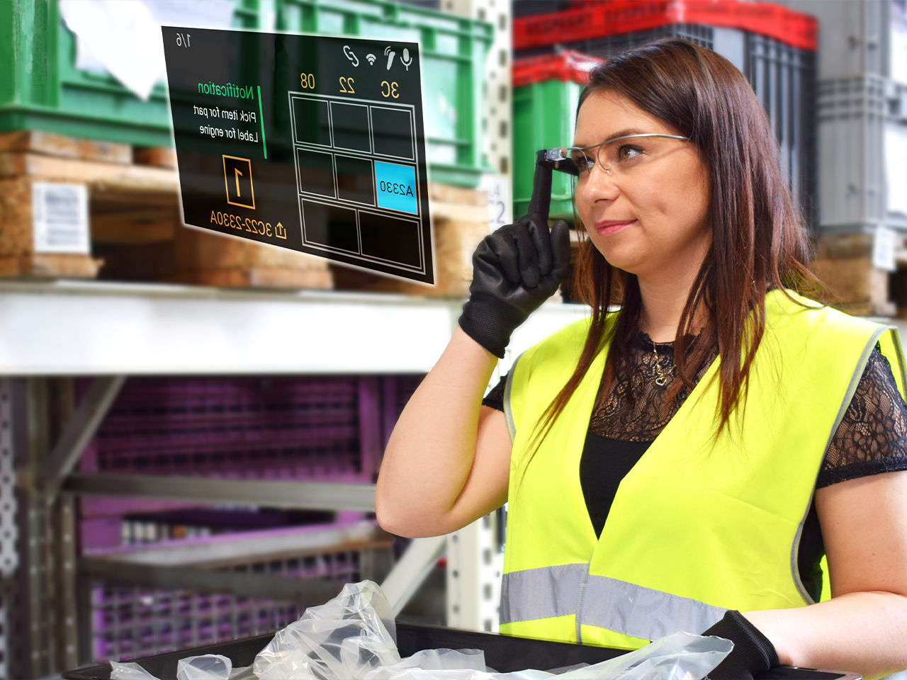 Woman in warehouse picking orders with TeamViewer Frontline