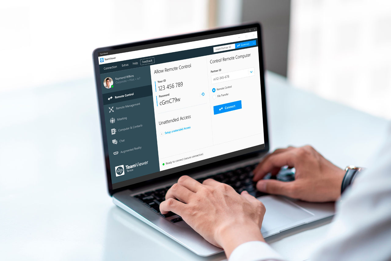 Man using TeamViewer Tensor on laptop at desk