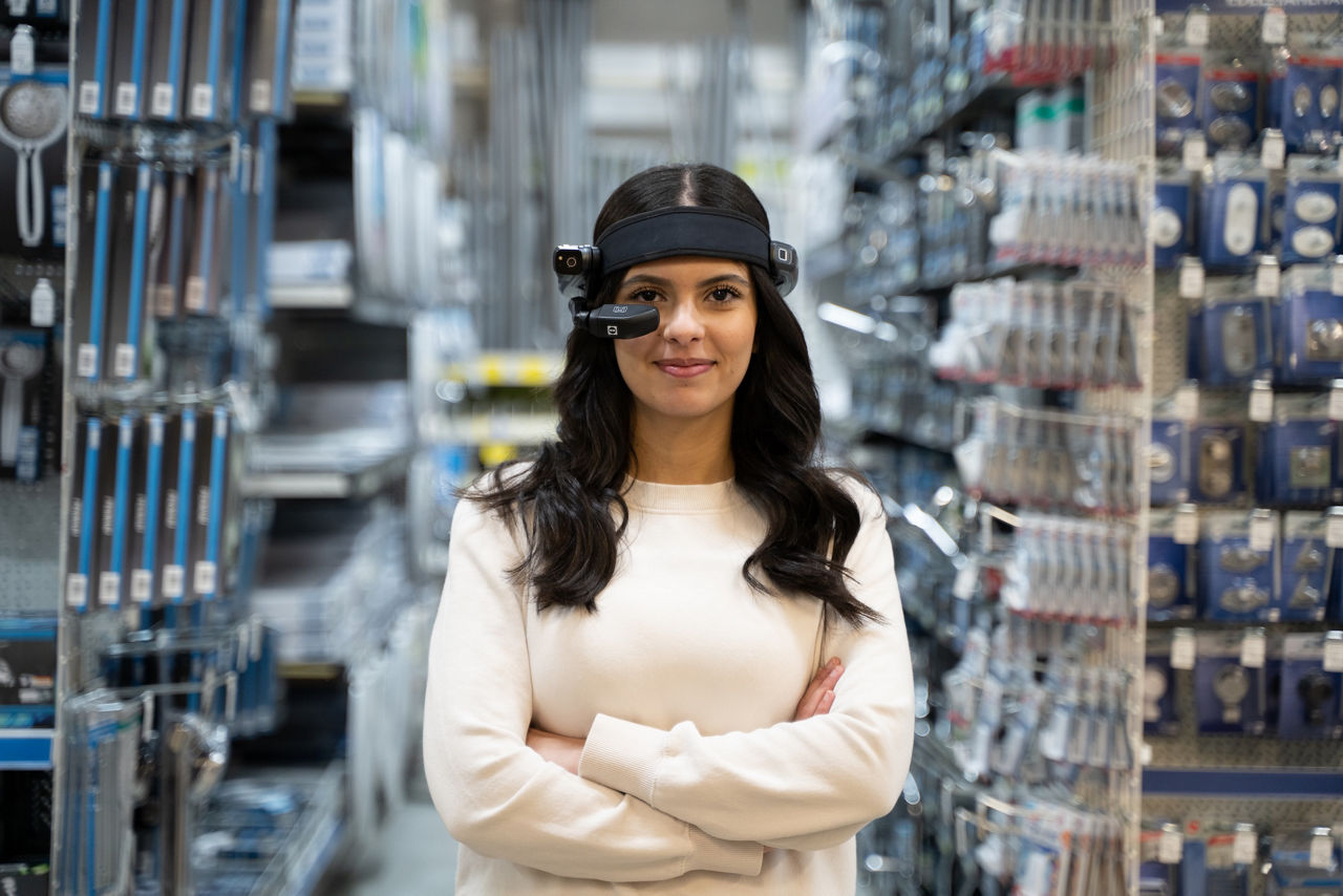 Manufacture worker fixing an issue with cables with the help of smart glasses