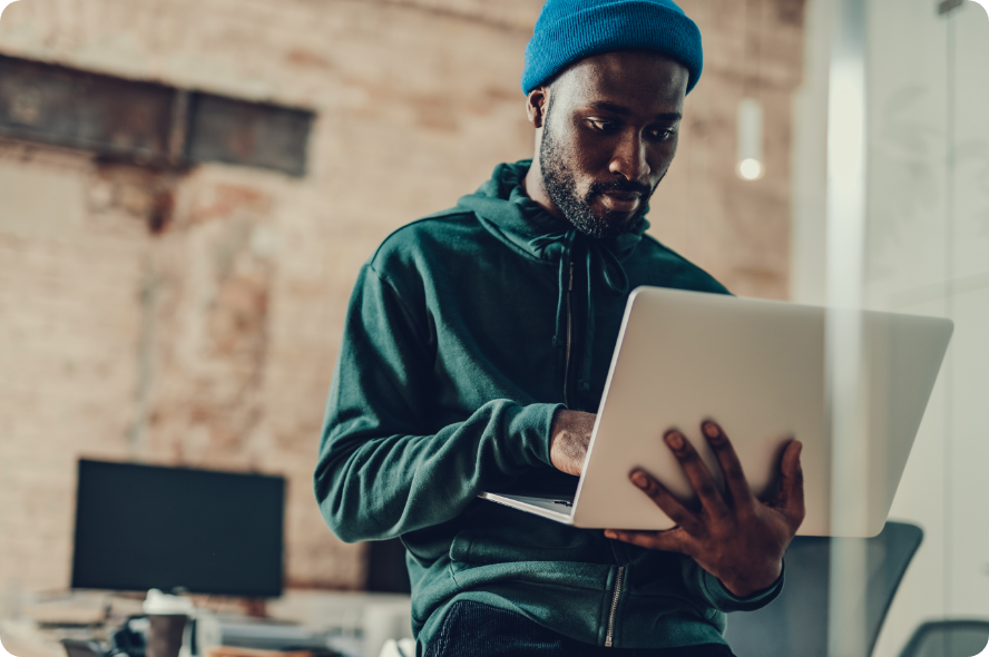 Man using laptop while standing