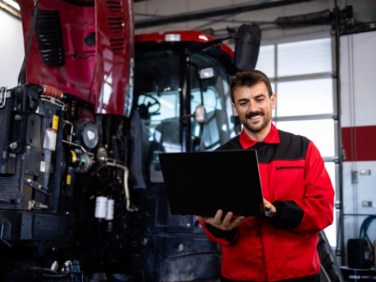 Mechanic working on tractor