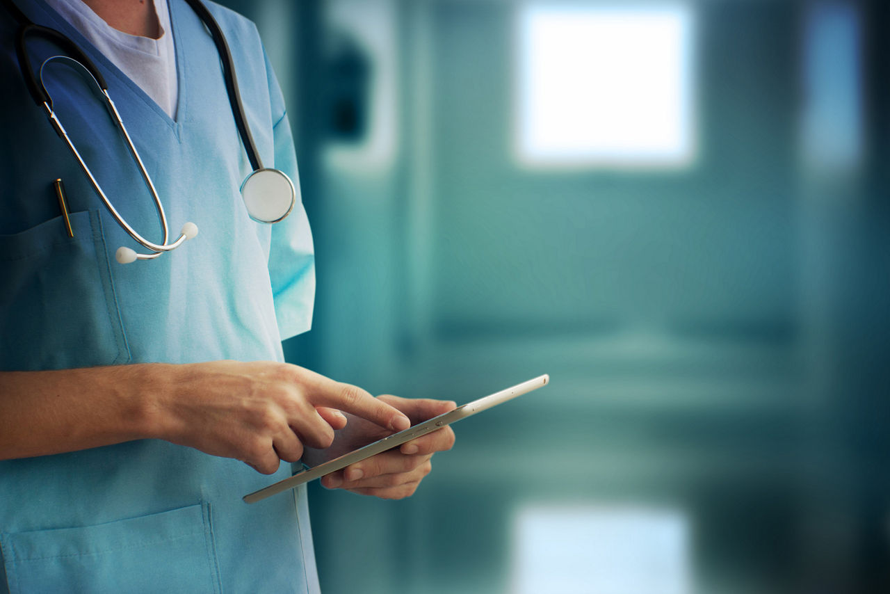 Doctor using a digital tablet