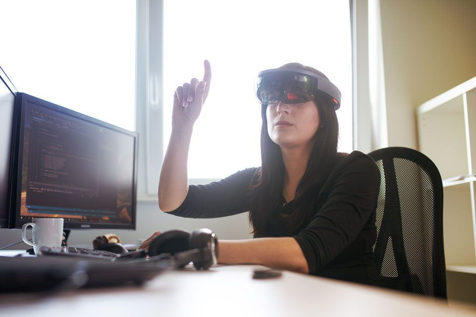 Woman wearing HoloLens smart glasses